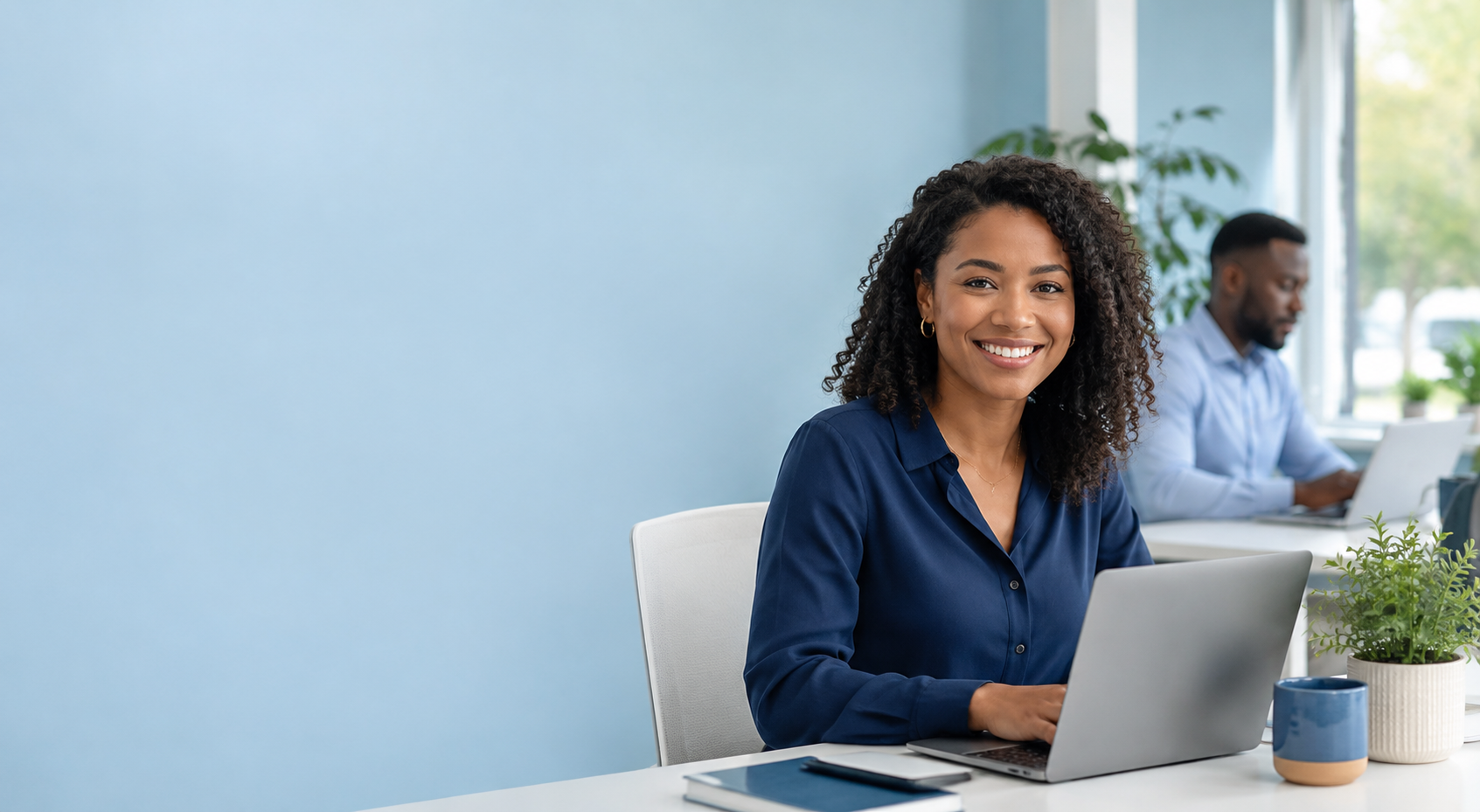 A Caribbean woman working at her desk while Work Caribbean AI-powered opportunities connect her to work